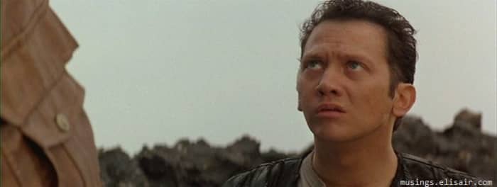 Schneider's "comedic" presence undermines the seriousness of the film, reducing it to a camp sci-fi parody instead of the subversive satire of the comics.