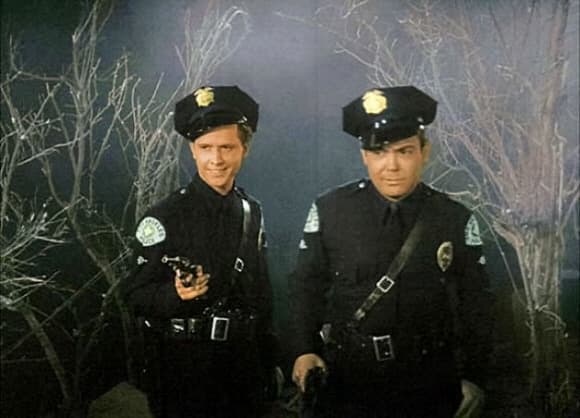 The film is actually part of a trilogy of Ed Wood films featuring Paul Marco (right) as cowardly cop Kelton.