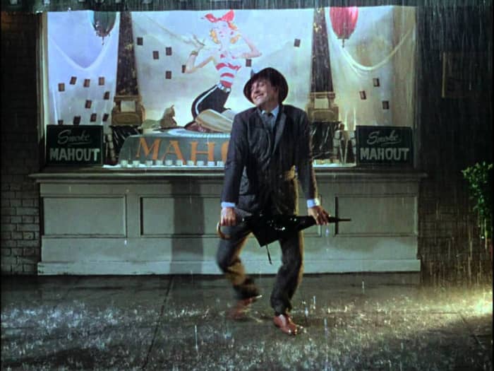 The iconic dance routine, filmed with Kelly suffering from a fever, is full of joy and fun despite the weather