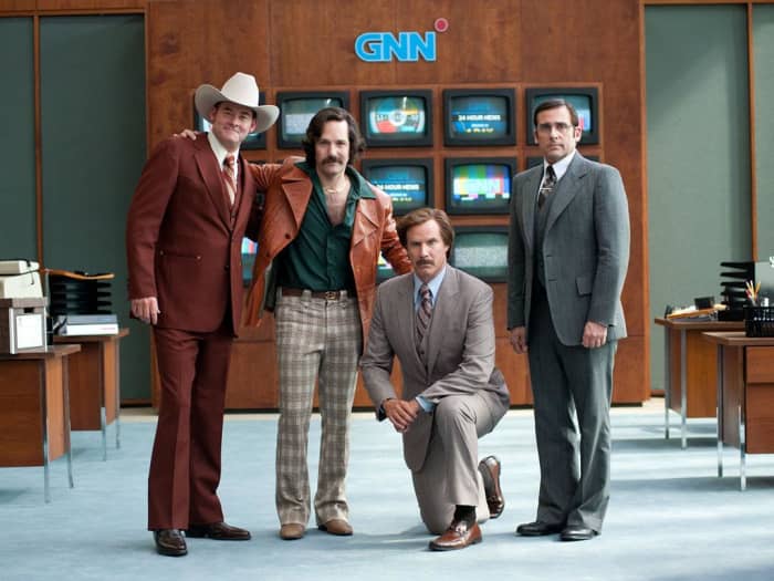 The oddness of local news may be a soft target but Ferrell (kneeling) goes for the jugular and has produced possibly his funniest film to date.