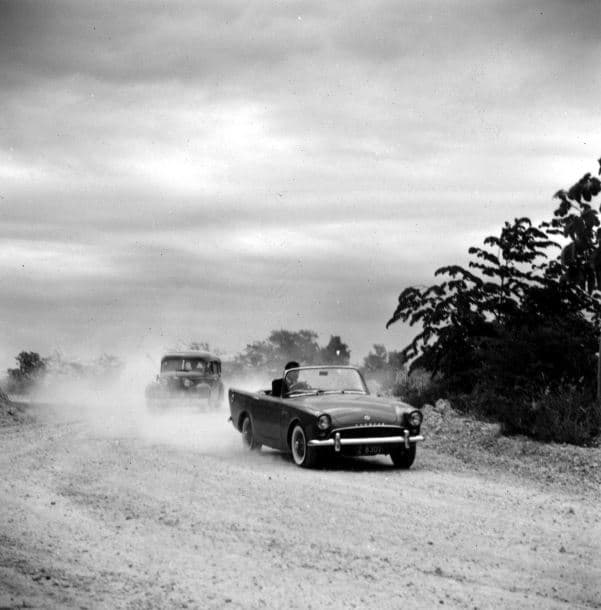 The first James Bond car, Sunbeam Alpine, is driven by Connery while being chased by The Three Blind Mice.