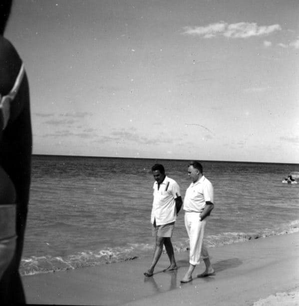 Strolling on the Jamaican beach, Cubby Broccoli and Harry Saltzman are deep in conversation about producing.