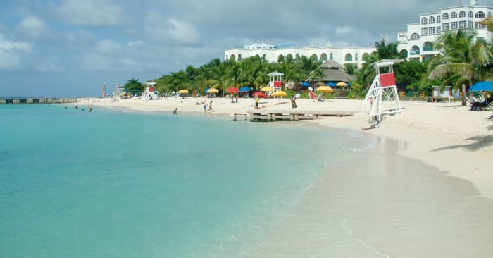 The pure Doctor's Cave beach sits in Montego Bay where most visitors to Jamaica find accommodations.