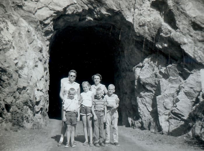 "One of the tunnels through rock on scenic route # 85A - Carol, Marge, Johnny, Billy & Tommy