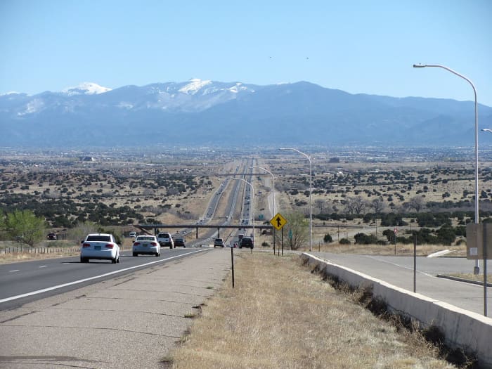 Interstate 25 approaching Santa Fe with Sangre de Christo Mountains in background.