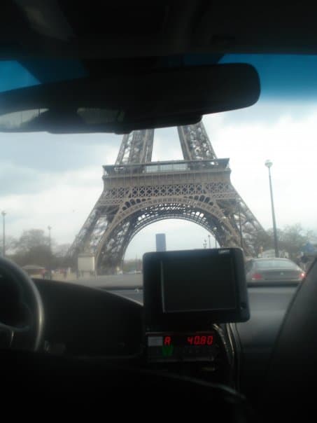 Driving past the Eiffel tower on the way to the hostel from the airport. To get from the airport to your hostel cheaply, use the metro which will cost you just a couple of Euros. A taxi will cost you over 50 Euros!