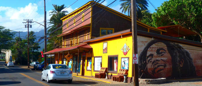 Surf shop with Bob Marley mural. All of the old buildings in Hale'iwa have been spruced up and newly repainted.