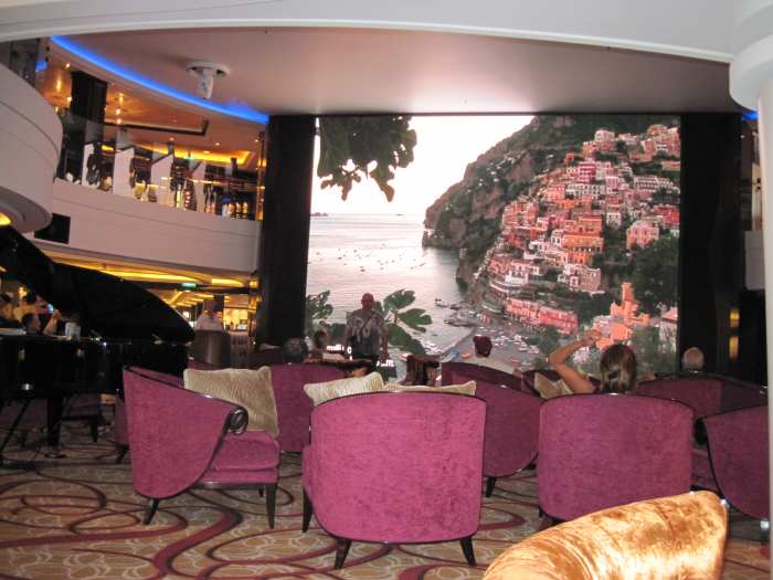 The atrium, although a bit of a disappointment, was a source of entertainment and relaxation because of the big screen with gorgeous pictures shown daily, and musical entertainment each night.