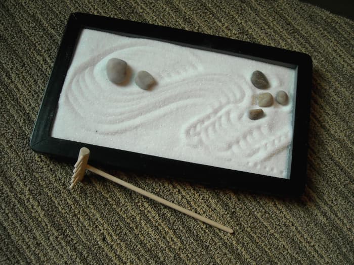 The Zen Garden. If you need to meditate, or if you have nothing better to do, you can move the rocks, rake the sand and ponder the meaning of life.