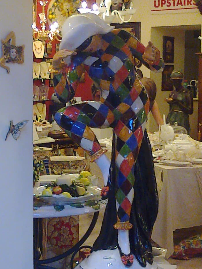 The mischievous Harlequin, one of the stock characters from the Commedia dell'arte, in full-size porcelain