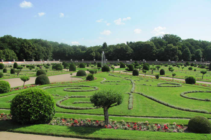 Diane de Poitiers' French gardens consist of eight triangular lawns and a water fountain in the middle. The raised terraces protect the garden when the Cher River overflows its banks.
