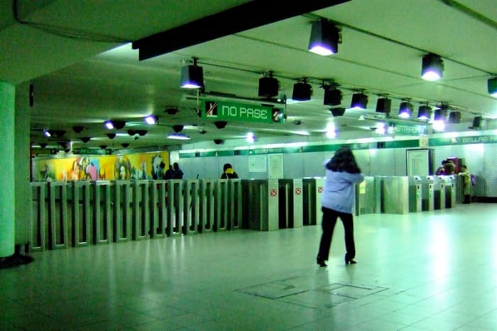 Turnstiles at Bellas Artes Subway Station. You can't go through the turnstiles marked with the red "X" under the "No Pase" sign.