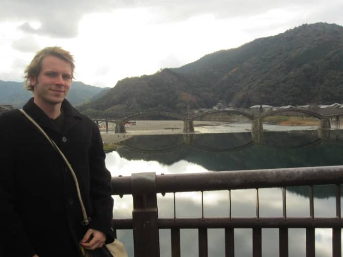 The author of this article, Ciaran, standing beside Kintai bridge, a Japanese national treasure and popular tourist destination.