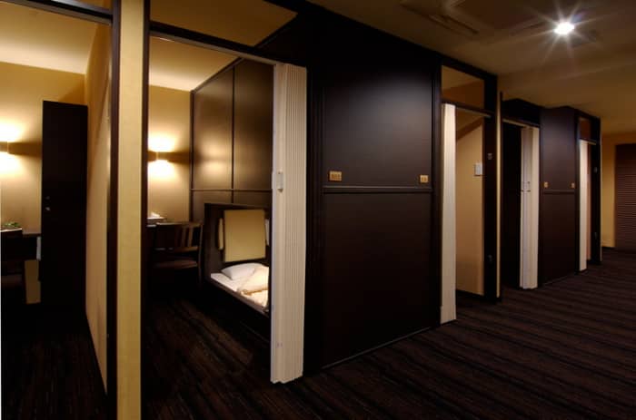 At Well Cabin Nakasu, private "cabins" (capsules) are available with a compact personal space and a sliding screen door for added privacy.