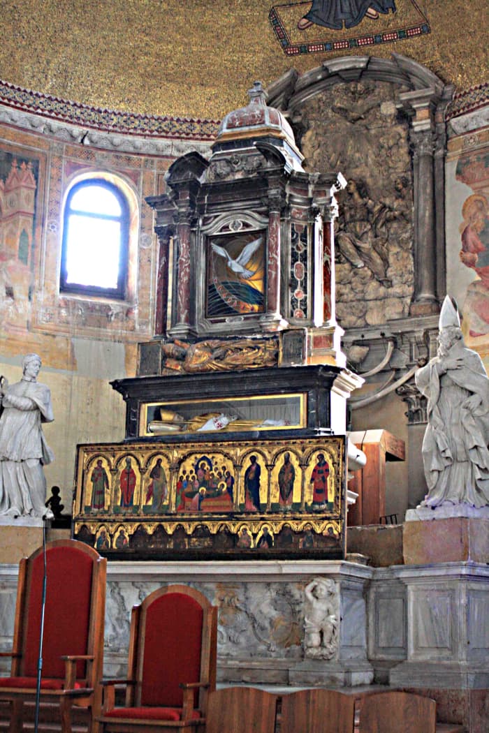 The altar of Santi Maria e Donato (two of the curved 'dragon ' bones can just be seen behind the altar on the right side)
