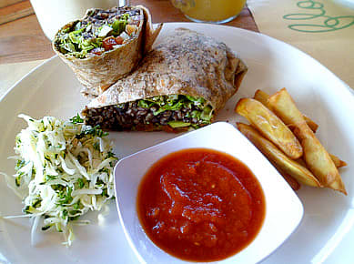 Down To Earth's Almost Perfect Burrito: brown rice, black bean, avocado, baked tofu, veggies, served with tomato salsa, sprouts, and fries.