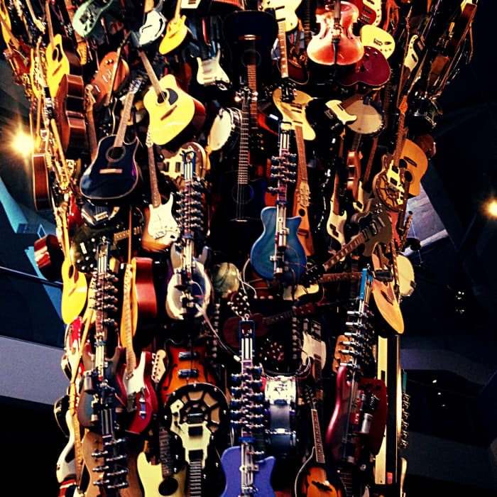 The guitar sculpture hanging from the ceiling of the EMP museum in Seattle, Washington. I cannot begin to count how many instruments make up this amazing art piece.