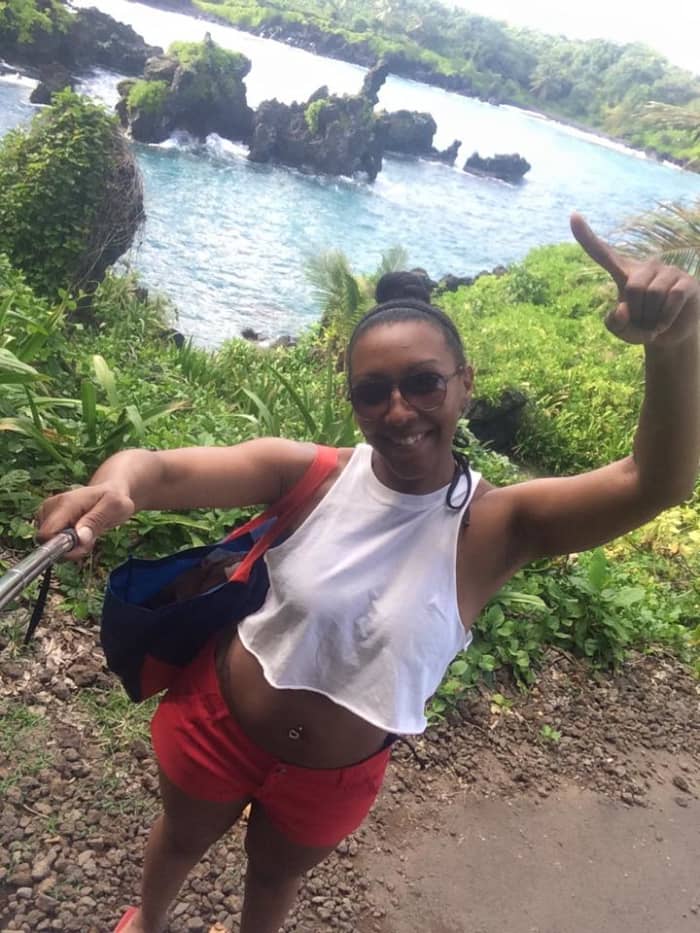 Wait, let me take a selfie! These rock formations are made out of lava, from a volcanic eruption long ago.