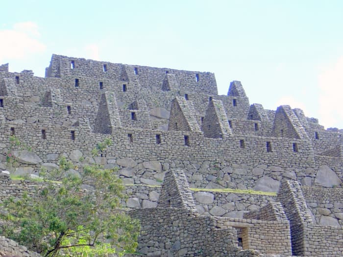 The finely crafted walls of Machu Picchu created by Inca workmen before 1500 A.D. contrast with the brilliant green vegetation of the area to produce lovely, inviting views.
