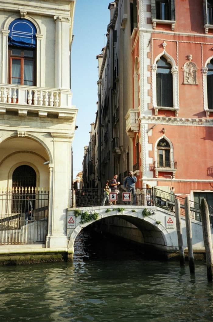 A small bridge over a canal, with interesting architectural touches on the adjacent buildings