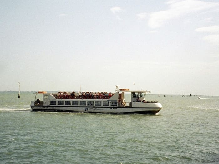 A small ferry, or vaporetto, takes visitors from a campground north of the city across the lagoon into Venice proper.