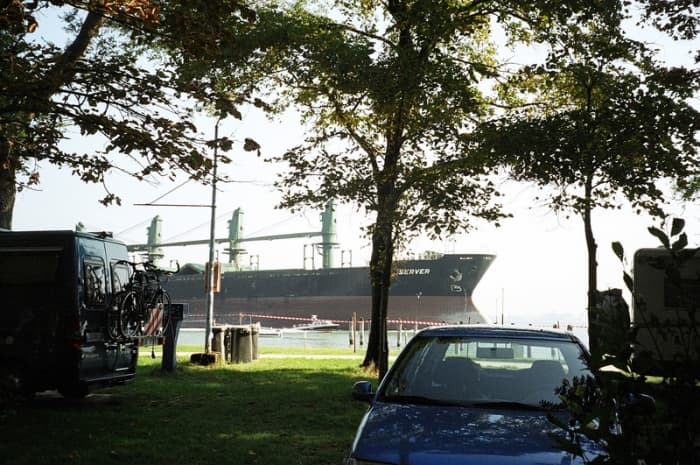 A freighter in the Veneta Lagoon north of the city of Venice passes near the Camping Fusina, one of the campgrounds on the mainland.