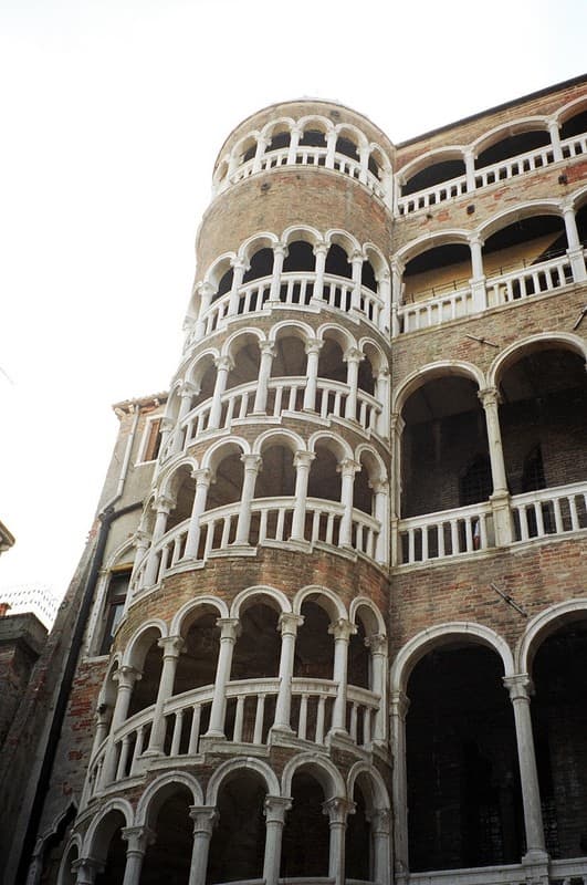This spiral staircase is called "Scala Contarini del Bovalo." The word "bovalo" means "snail" in Italian. The unique staircase connects the floors of the small Contarini palace near the Rialto Bridge.