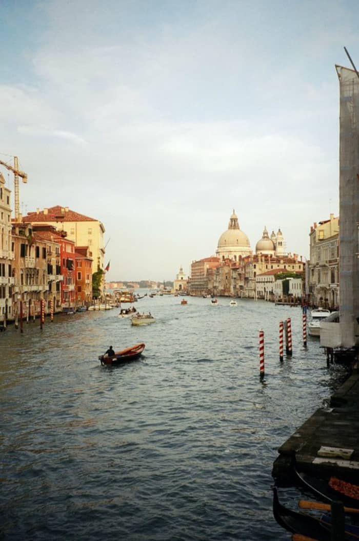 Looking west from St. Mark's Canal toward St. Mark's Basilica with many boats plying the canal.