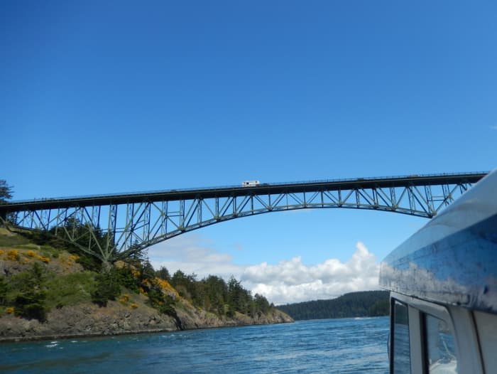 The view from our small boat's pilot house shows the fine lines of Deception Pass Bridge on Highway 20, spanning the strait between Fidalgo Island and Whidbey Island, leading to Cornet Bay.