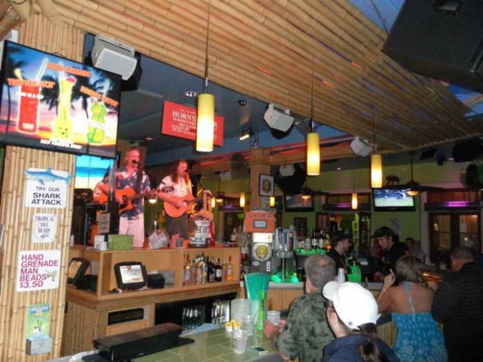 A bar known for boozy Hand Grenade cocktails plus live music, bar bites & balcony views
