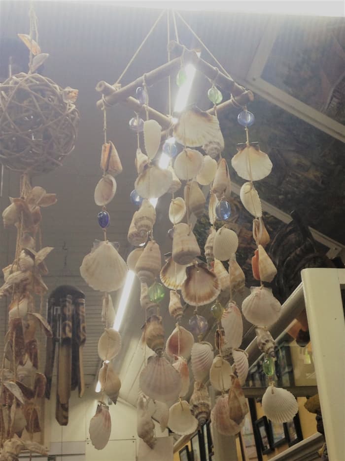 Shopping for crafts like this wind chime made from seashells is a great thing to do at Devon House after a tour of the historic house.