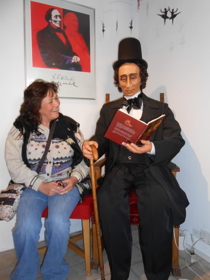As you can see I am enjoying being read to by Hans Christian Andersen in the gift shop in Nyhavn!