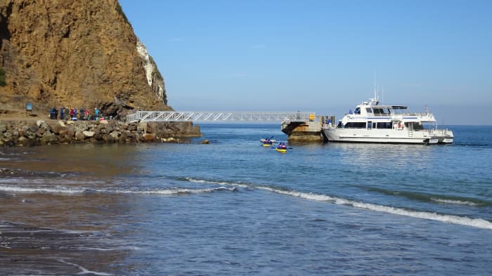 Docking at Scorpion Anchorage. The Island Explorer, docked at Santa Cruz Island. Passengers must ascend a short ladder to access the bridge to the island.