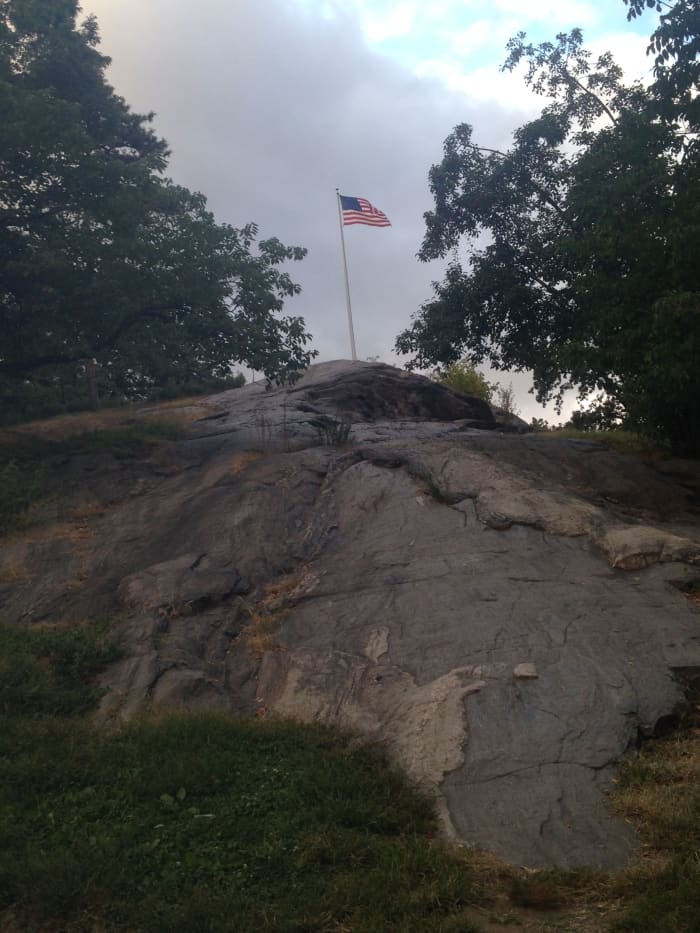 Boulders like this one (around Harlem Meer on Central Park's north side) tempt kids to go rock climbing in the summer.