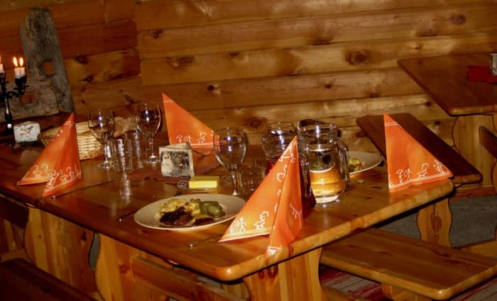 The kota-building provides a cosy spot for some Finnish cuisine and a place by a warm fire.