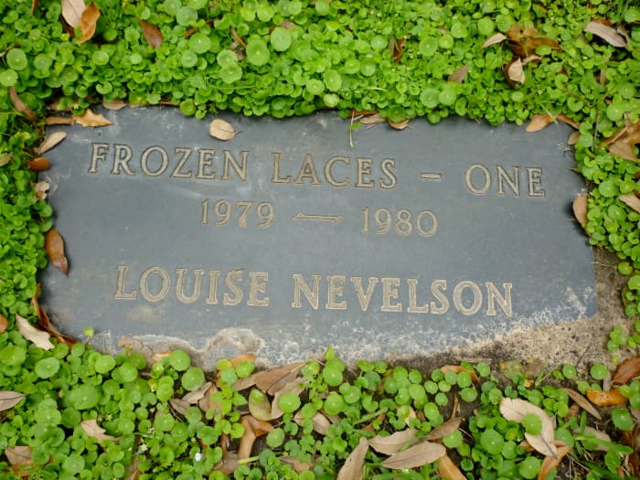 Marker in the ground identifying Frozen Laces - One sculpture by Louise Nevelson