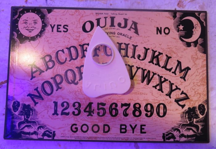 Your homemade Ouija board can be any color you want. Commercial planchettes (pointers) are made of plastic, but you can use any material.