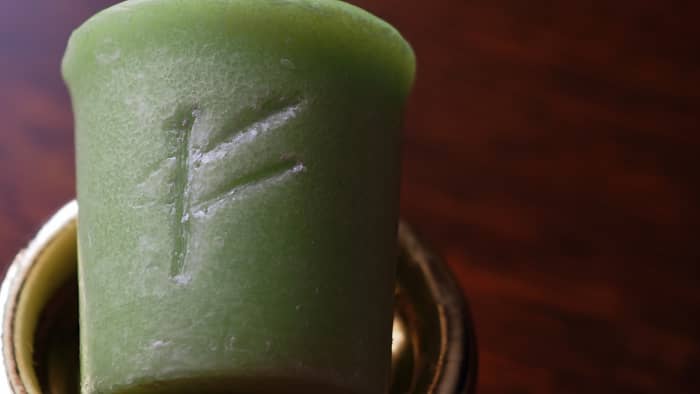 Carving a rune into your candle can help make your spell more powerful. The rune Fehu represents wealth.