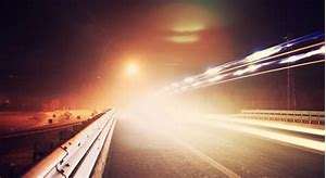 Blinding lights on an otherwise dark highway can be alarming. They can also, at times, be someone's way of saying goodbye.