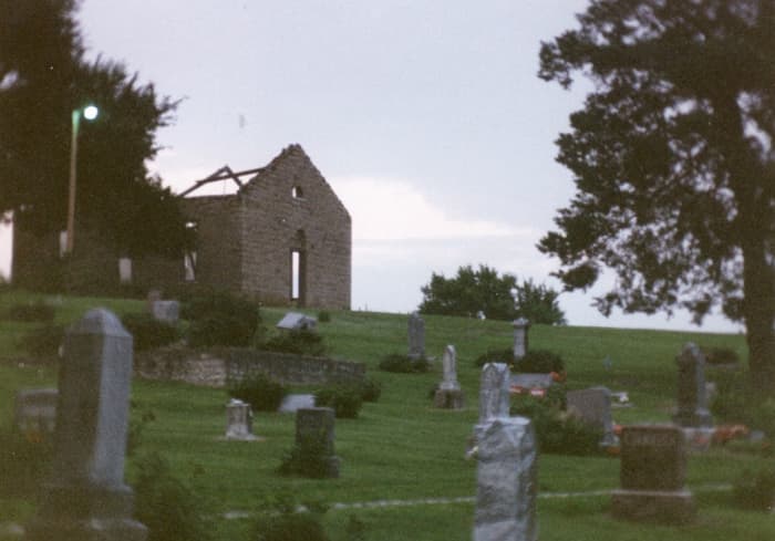 Stull Cemetery prominently featuring the roofless ruins of the church where the witches met long ago.