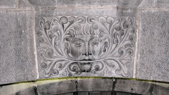 The pagan Greenman who guards the entrance to the crypt, the oldest part of the cathedral in Gent Belgium.