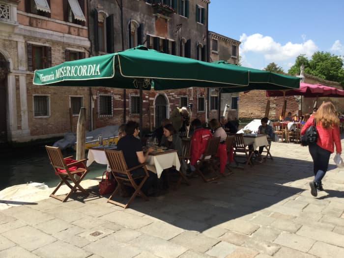 We ate a three-course lunch, including a glass of wine, by one of the quieter canals and were treated to music by strolling players.