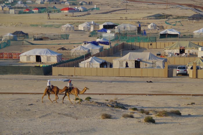 A view from the mid-way point of the hill. Camels walk pass by our camp in the background (December 2015).