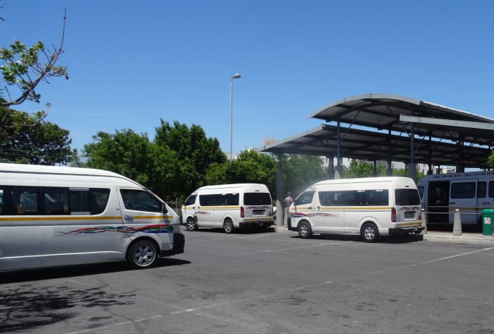Mini Buses have select places where they park and wait for fares. They can also be hailed as they pass by in the same way that you would hail a cab.