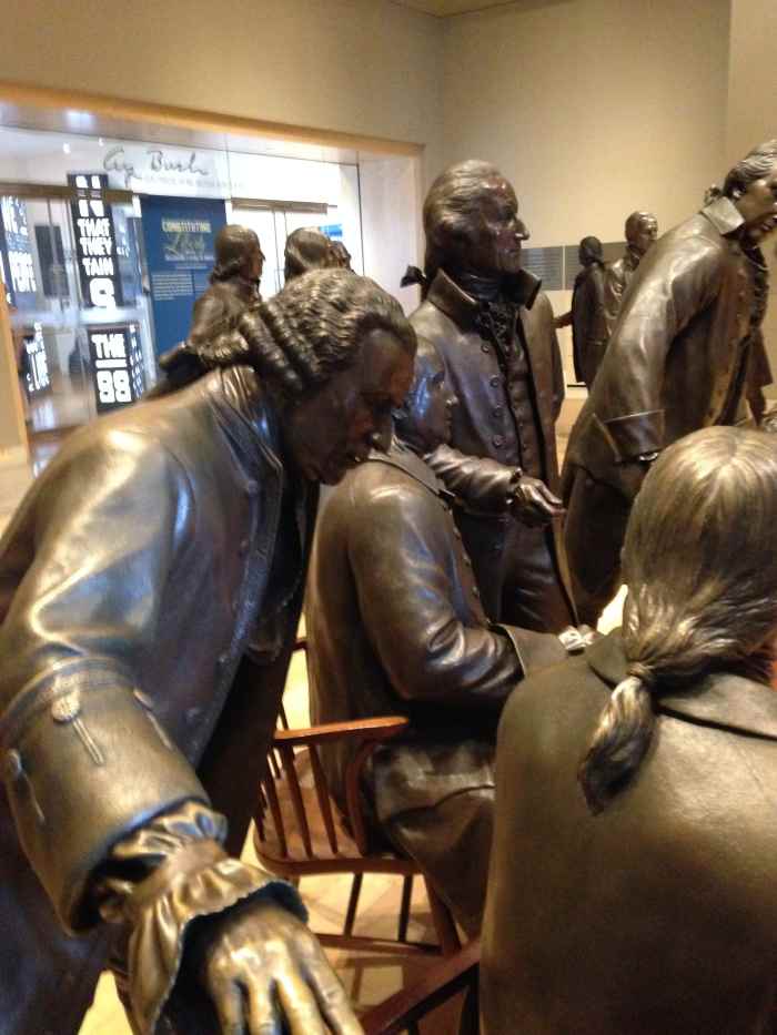 Representatives from each colony in bronze inside the Constitution Center, positioned as they were when they ratified the most important document in our history.