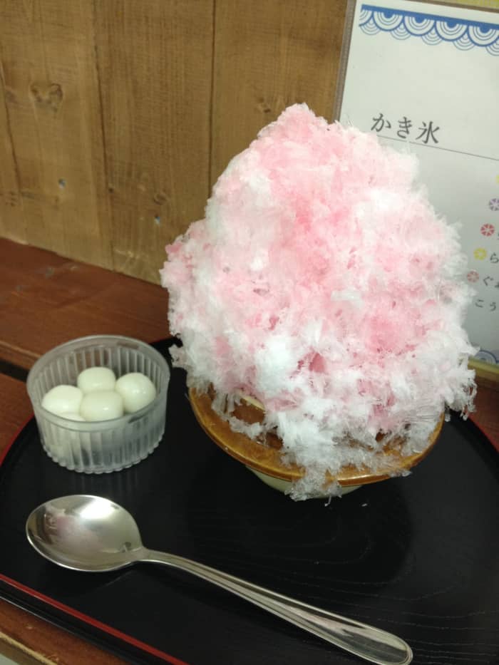 Kaki-gori with mochi balls from a specialty 氷 shop. This one is the fluffy type of shaved ice that doesn't even need to be chewed. Perfect for a hot day!