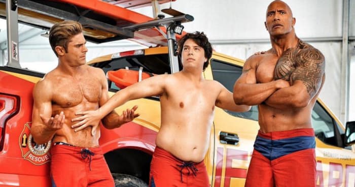 Zac Efron, Jon Bass, and Dwayne Johnson as Matt Brody, Ronnie Greenbaum, and Mitch Buchannon in "Baywatch."