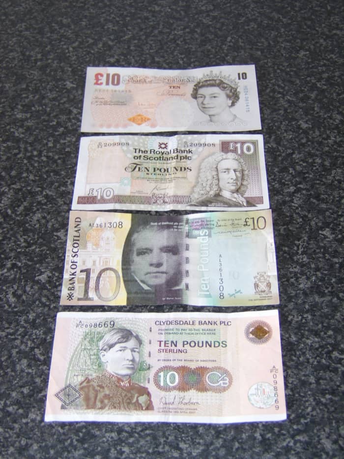 Examples of the different notes you will encounter in Scotland on a daily basis. These are all 10 pound notes and are issued by (from top to bottom) Bank of England, Royal Bank of Scotland, Bank of Scotland and Clydesdale Bank