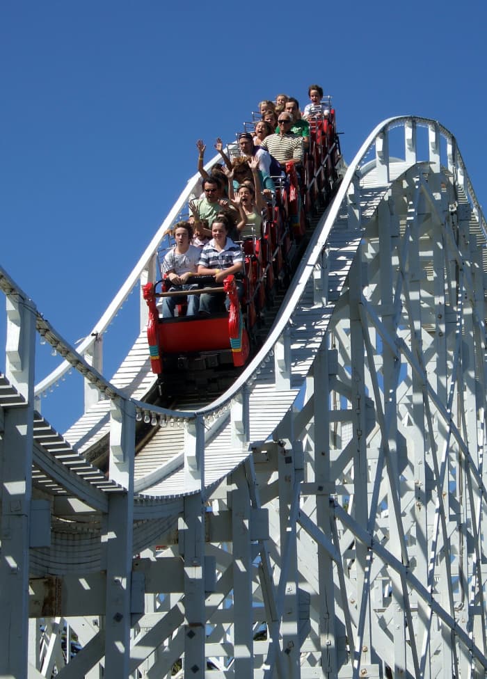 The Scenic Railway in Luna Park is the world's oldest operating roller coaster. Note the brakeman in the middle of the carriage.