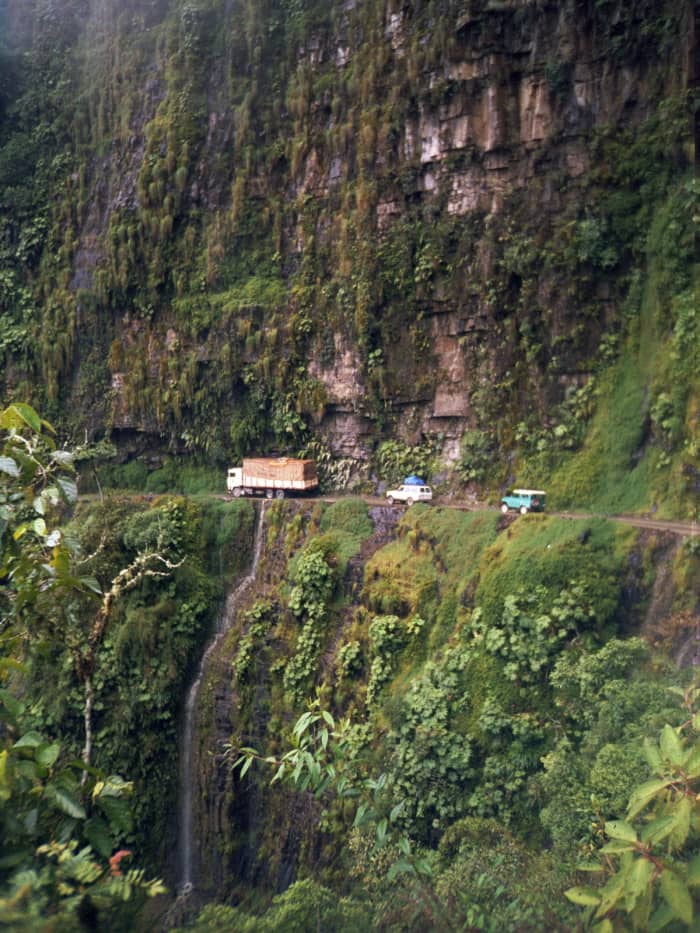 A procession of vehicles making their way along Bolivia's North Yungas Road.